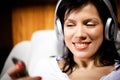 Women listening music in headphones Royalty Free Stock Photo
