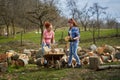 Women loading wood in the wheelbarrow