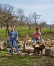 Women loading wood in the wheelbarrow