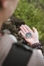Women looked at the compass in her hand to find right direction Royalty Free Stock Photo