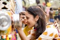 Women looking into bioscope at Surajkund Mela