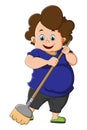 The women maid is sweeping the floor with the broom Royalty Free Stock Photo