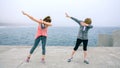 Women making dab dance outdoors