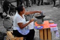 Women making tortillas in a Mexico market