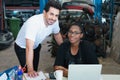 Women and man happy working together. Diversity of two people, caucasian business manager work with African worker woman in Royalty Free Stock Photo