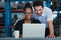 Women and man smiling and working together. Diversity of two people, caucasian business manager work with African worker woman in Royalty Free Stock Photo