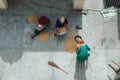 Women manual cleaning of grain from garbage in India