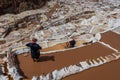 Women Maras salt mines peruvian Andes Cuzco Peru Royalty Free Stock Photo