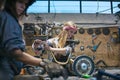 women mechanics repairing children bicycle in workshop