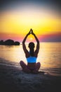 Women meditation pose at amazing sunset Royalty Free Stock Photo