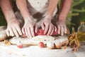 Women and men baker hands recipe pasta butter cook tomato preparation dough and making bread Royalty Free Stock Photo