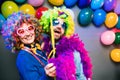 Women and men celebrating at party for new years eve or carnival