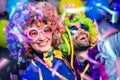 Women and men celebrating at party for new years eve or carnival Royalty Free Stock Photo