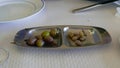 Women and Men Hands Taking Olives from Bowl