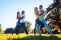 Women and men having fun dancing in the park Royalty Free Stock Photo
