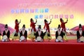 Women and men jump uighur dance