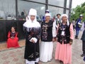 Women and men in the Kyrgyz national dress.