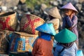 Women and men standing and waiting for the fishing boats Royalty Free Stock Photo