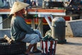 Women and men standing and waiting for the fishing boats Royalty Free Stock Photo