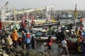 Women and men standing and waiting for the fishing boats Royalty Free Stock Photo