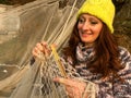 Women mend a fishing net Royalty Free Stock Photo