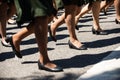 Military marching in a street. Legs and shoes in line