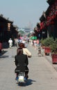 Women on moped in old town of Pingyao Royalty Free Stock Photo