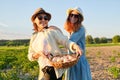 Women mother and daughter with basket of eggs, lifestyle, nature, garden background Royalty Free Stock Photo