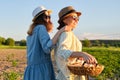 Women mother and daughter with basket of eggs, lifestyle, nature, garden background Royalty Free Stock Photo