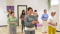 Women moving coordinated closing a qi gong class