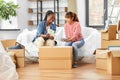 women moving to new home and counting money Royalty Free Stock Photo