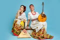 Women musicians in Russian folk dresses with musical instruments o Royalty Free Stock Photo