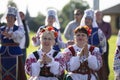 Women in national Slavic clothes at the celebration.