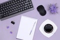 Women neat workplace. Keyboard with computer mouse, blank notebook, stationery, coffee cup on office desk. Top view, flatlay