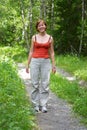 Women on old road in forest Royalty Free Stock Photo