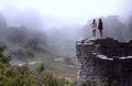 Women Overlooking Bright Foggy Valley