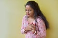 Women with pain at the heart. Young women with heart disease. Women have symptoms of heart attack, congestive heart failure