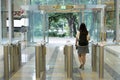 Women people walking out from security at an entrance gate with key card access control smart office building