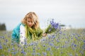 Women picking blue flowers