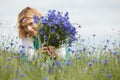 Women picking blue flowers