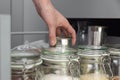 Women picking an item from storage hutch. Smart kitchen organization concept Royalty Free Stock Photo