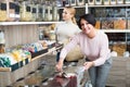 Women picking nuts and dried fruits in store Royalty Free Stock Photo