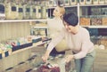 Women picking nuts and dried fruits in store Royalty Free Stock Photo