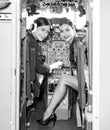 Women Pilot and Flight Instructor in Aircraft Cockpit. Beautiful Smiling Young Women Pilots Sitting in Cabin of Aircraft Royalty Free Stock Photo