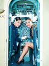Women Pilot and Flight Instructor in Aircraft Cockpit. Beautiful Smiling Young Women Pilots Sitting in Cabin of Aircraft Royalty Free Stock Photo