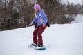 Women riding a snowboard at winter Royalty Free Stock Photo