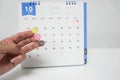 Women with planner sticker for training, birthday party and dinner on October calendar