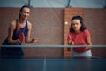 Women play doubles table tennis, ping pong players Royalty Free Stock Photo