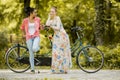 Women posing by the bicycle Royalty Free Stock Photo