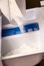 Women is pouring powder detergent in wesh machine Royalty Free Stock Photo